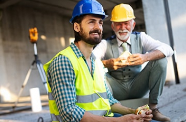 Two workers taking a break on a building site