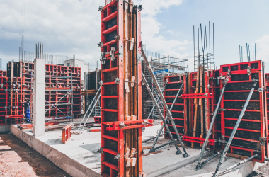 Red column formwork erected on a construction site