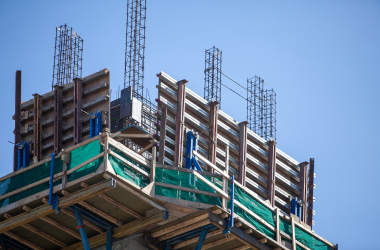 Formwork and scaffolding at the edge of a concrete slab under construction